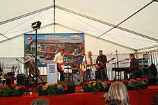 Plakat im Festzelt, der Chevrolet Orlando

Die 3 Z`widern mit viertem Mann

Früh übt sich wer ein Rennfahrer werden will

aber sich für ein Auto zu entscheiden ist schwer

Fuhrpark der KFZ-Mayer in Mauerham

Fuhrpark der KFZ-Mayer in Mauerham

Fuhrpark der KFZ-Mayer in Mauerham

Der Parkplatz war trotz des schlechten Wetters vollgeparkt

Der Parkplatz war trotz des schlechten Wetters vollgeparkt

Fuhrpark der KFZ-Mayer in Mauerham

Plakate im alten und neuem Chevrolet-Design

Hildegard Mayer beim Systemmarketing Stand

Von den Süßigkeiten war am Ende nichts mehr über

Die Technik vom Systemmarketing Stand ist vorbereitet

Firma Systemmarketing gratuliert zu 20 Jahren KFZ Mayer, mit Blumen...

... und einer großen Flasche Bier

Gar nicht so leicht sie loszulassen

Blumenstrauß und Bier - so gratulieren wir: Systemmarketing GmbH

Gruppenfoto Hildegard und Michael Mayer mit dem Team der Systemmarketing GmbH und Verena

99 Luftballons, aber sie fliegen noch nicht am Horizont

Links Hindernissparcours für die Rauschbrille und geradeaus das Festzelt

CardioZone & Adventuressport

Adventure-Sport Stand 

Die Neuwagenausstellung im Keller war eine Besichtigung wert

Die 3 Z`widern

Die Belegschaft von KFZ-Mayer zur allgemeinen Begrüßung auf der Bühne

Die Belegschaft von KFZ-Mayer zur allgemeinen Begrüßung auf der Bühne

Der Systemmarketing Stand war gut besucht

Der Systemmarketing Stand war gut besucht

Herr Steiner erhielt zum 60. Geburtstag ein Präsent von KFZ-Mayer

und von der Systemmarketing GmbH einen Gutschein für ein Wellness-Wochenende

KFZ-Mayer und Systemmarketing GmbH wünschten dem Geburtstagskind alles Gute

Das Fest war gut besucht

Noch schnell mal einen Soundcheck

Die Band von Claudia Koreck steht schon bereit

Claudia Koreck und Band sorgten für Stimmung im Festzelt

Claudia Koreck und Band sorgten für Stimmung im Festzelt

Claudia Koreck und Band sorgten für Stimmung im Festzelt

Das ganze Zelt war voll

Nebst interessierten, auch desinteressierte Gesichter

Claudia Koreck und Band

Claudia Koreck und Band

Nach dem Konzert eine kleine Ansprache von Hans Mayer

Ein Dank an die Familie Graewert und Koreck für gute Zusammenarbeit

Blumen für die Damen, Rucksäcke für die Herren und das BobbyCar für den Nachwuchs

Kurze Worte von Moderator Hans Mayer

Die 3 Z`widern

Die 3 Z`widern

Vor der Preisverteilung wurde der 1. Preis ins Festzelt gefahren

Kurze Worte zum Ablauf und begrüßung der Notare

Ehrung der 1. Kunden die ein ganzes Auto gekauft haben

Diese 2 haben richtig geschätzt wieviele Bälle im Chevrolet Orlando waren: 138 Stück

Glücksfee Verena darf gleich die Lose ziehen

Michael Mayer auf der Bühne

Ein paar Worte vom Notar zur Verlosung

Michael Mayer liest gleich die gezogenen Nummern vor

Mitarbeiter von KFZ-Mayer holen jeweils die Preise aus dem Auto

Ablauf einer Glücksfee: Nummer ziehen und dem Notar zeigen

Warten auf den Gewinner

Michael und Hans Mayer hatten viel Spaß bei der Moderation

Obligatorischer Nummern-Vergleich und notieren der Adresse der Gewinner/in

Schön weggucken und ne neue Nummer ziehen

Nummer zum vorlesen überreichen

Blumenschmuck auf der Bühne

Blumenschmuck auf der Bühne

Warten auf die neue Ziehung: Beide Notare, Hildegard Mayer und Glücksfee Verena

Insgesamt gab es 30 Preise zu gewinnen

Kurze Erfrischung auf der Bühne

Und weiter im Programm

Die Besucher im Zelt warten schon gespannt auf die nächste Nummer

Langsam nähern wir uns dem Ende

Insgesamt gab es mehr weibliche als männliche Gewinner

Nächster Preis: Rucksäcke mit Inhalt

Nummernvergleich beim Notar und gleich danch erhält der Gewinner seinen Picknickkorb

Michael Mayer bei der nächsten Nummer

Und wieder ein Gewinner

Wer im Zelt keinen Platz mehr hatte stand vorm Eingang

Prost

Prost

Spannung pur

Kleine Pause mit einer Darbietung von den 3 Z`widern

das nächste Los

Warten auf den Gewinner

Wer sich wohl meldet

Gespannte Gesichter

Durch eine kurzfristige Spende gabs zwei zweite Preise

Der 1. zweite Preis ein Gutschein für ein Wellness Wochenende

Ziehung des 2. zweiten Preises

Nummernübergabe

Der 2. zweite Preis war ein Rundflug mit dem Xcitor 

Ums spannend zu machen: Pause vorm großen Finale

Instruktionen an die Glücksfee

Applaus an die 3 Z´widern

Schön weggucken beim Gewinnerlos

Dem Notar zur Ansicht zeigen

Alles in Ordnung, jetzt kanns gleich verlesen werden

So, wer ist wohl der glückliche Gewinner?

Blick in die Runde wo der Gewinner auftaucht.

Kurzes Warten auf den Gewinner

Foto mit dem Gewinner des Chevrolet Sparks mit Michael und Hildegard Mayer und Glücksfee Verena

Nach der Verlosung wurde das Zelt schnell leerer

Das Wort geht an den Herrn Notar

Abschließende Worte von Moderator Hans Mayer

Begutachtung des Gewinns

Probesitzen

Wie sich unser Gewinner jetzt wohl fühlt !?

Der Tag danach - soviele Geschenke gab es

Was für ein Wetter - das hätte man gestern haben müssen

Fuhrpark im Sonnenschein

Vereinzelt stehen noch Autos auf dem Parkplatz

Wir bedanken uns bei allen Besuchern - es war ein tolles Fest
