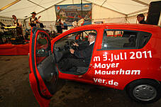 Plakat im Festzelt, der Chevrolet Orlando

Die 3 Z`widern mit viertem Mann

Früh übt sich wer ein Rennfahrer werden will

aber sich für ein Auto zu entscheiden ist schwer

Fuhrpark der KFZ-Mayer in Mauerham

Fuhrpark der KFZ-Mayer in Mauerham

Fuhrpark der KFZ-Mayer in Mauerham

Der Parkplatz war trotz des schlechten Wetters vollgeparkt

Der Parkplatz war trotz des schlechten Wetters vollgeparkt

Fuhrpark der KFZ-Mayer in Mauerham

Plakate im alten und neuem Chevrolet-Design

Hildegard Mayer beim Systemmarketing Stand

Von den Süßigkeiten war am Ende nichts mehr über

Die Technik vom Systemmarketing Stand ist vorbereitet

Firma Systemmarketing gratuliert zu 20 Jahren KFZ Mayer, mit Blumen...

... und einer großen Flasche Bier

Gar nicht so leicht sie loszulassen

Blumenstrauß und Bier - so gratulieren wir: Systemmarketing GmbH

Gruppenfoto Hildegard und Michael Mayer mit dem Team der Systemmarketing GmbH und Verena

99 Luftballons, aber sie fliegen noch nicht am Horizont

Links Hindernissparcours für die Rauschbrille und geradeaus das Festzelt

CardioZone & Adventuressport

Adventure-Sport Stand 

Die Neuwagenausstellung im Keller war eine Besichtigung wert

Die 3 Z`widern

Die Belegschaft von KFZ-Mayer zur allgemeinen Begrüßung auf der Bühne

Die Belegschaft von KFZ-Mayer zur allgemeinen Begrüßung auf der Bühne

Der Systemmarketing Stand war gut besucht

Der Systemmarketing Stand war gut besucht

Herr Steiner erhielt zum 60. Geburtstag ein Präsent von KFZ-Mayer

und von der Systemmarketing GmbH einen Gutschein für ein Wellness-Wochenende

KFZ-Mayer und Systemmarketing GmbH wünschten dem Geburtstagskind alles Gute

Das Fest war gut besucht

Noch schnell mal einen Soundcheck

Die Band von Claudia Koreck steht schon bereit

Claudia Koreck und Band sorgten für Stimmung im Festzelt

Claudia Koreck und Band sorgten für Stimmung im Festzelt

Claudia Koreck und Band sorgten für Stimmung im Festzelt

Das ganze Zelt war voll

Nebst interessierten, auch desinteressierte Gesichter

Claudia Koreck und Band

Claudia Koreck und Band

Nach dem Konzert eine kleine Ansprache von Hans Mayer

Ein Dank an die Familie Graewert und Koreck für gute Zusammenarbeit

Blumen für die Damen, Rucksäcke für die Herren und das BobbyCar für den Nachwuchs

Kurze Worte von Moderator Hans Mayer

Die 3 Z`widern

Die 3 Z`widern

Vor der Preisverteilung wurde der 1. Preis ins Festzelt gefahren

Kurze Worte zum Ablauf und begrüßung der Notare

Ehrung der 1. Kunden die ein ganzes Auto gekauft haben

Diese 2 haben richtig geschätzt wieviele Bälle im Chevrolet Orlando waren: 138 Stück

Glücksfee Verena darf gleich die Lose ziehen

Michael Mayer auf der Bühne

Ein paar Worte vom Notar zur Verlosung

Michael Mayer liest gleich die gezogenen Nummern vor

Mitarbeiter von KFZ-Mayer holen jeweils die Preise aus dem Auto

Ablauf einer Glücksfee: Nummer ziehen und dem Notar zeigen

Warten auf den Gewinner

Michael und Hans Mayer hatten viel Spaß bei der Moderation

Obligatorischer Nummern-Vergleich und notieren der Adresse der Gewinner/in

Schön weggucken und ne neue Nummer ziehen

Nummer zum vorlesen überreichen

Blumenschmuck auf der Bühne

Blumenschmuck auf der Bühne

Warten auf die neue Ziehung: Beide Notare, Hildegard Mayer und Glücksfee Verena

Insgesamt gab es 30 Preise zu gewinnen

Kurze Erfrischung auf der Bühne

Und weiter im Programm

Die Besucher im Zelt warten schon gespannt auf die nächste Nummer

Langsam nähern wir uns dem Ende

Insgesamt gab es mehr weibliche als männliche Gewinner

Nächster Preis: Rucksäcke mit Inhalt

Nummernvergleich beim Notar und gleich danch erhält der Gewinner seinen Picknickkorb

Michael Mayer bei der nächsten Nummer

Und wieder ein Gewinner

Wer im Zelt keinen Platz mehr hatte stand vorm Eingang

Prost

Prost

Spannung pur

Kleine Pause mit einer Darbietung von den 3 Z`widern

das nächste Los

Warten auf den Gewinner

Wer sich wohl meldet

Gespannte Gesichter

Durch eine kurzfristige Spende gabs zwei zweite Preise

Der 1. zweite Preis ein Gutschein für ein Wellness Wochenende

Ziehung des 2. zweiten Preises

Nummernübergabe

Der 2. zweite Preis war ein Rundflug mit dem Xcitor 

Ums spannend zu machen: Pause vorm großen Finale

Instruktionen an die Glücksfee

Applaus an die 3 Z´widern

Schön weggucken beim Gewinnerlos

Dem Notar zur Ansicht zeigen

Alles in Ordnung, jetzt kanns gleich verlesen werden

So, wer ist wohl der glückliche Gewinner?

Blick in die Runde wo der Gewinner auftaucht.

Kurzes Warten auf den Gewinner

Foto mit dem Gewinner des Chevrolet Sparks mit Michael und Hildegard Mayer und Glücksfee Verena

Nach der Verlosung wurde das Zelt schnell leerer

Das Wort geht an den Herrn Notar

Abschließende Worte von Moderator Hans Mayer

Begutachtung des Gewinns

Probesitzen

Wie sich unser Gewinner jetzt wohl fühlt !?

Der Tag danach - soviele Geschenke gab es

Was für ein Wetter - das hätte man gestern haben müssen

Fuhrpark im Sonnenschein

Vereinzelt stehen noch Autos auf dem Parkplatz

Wir bedanken uns bei allen Besuchern - es war ein tolles Fest